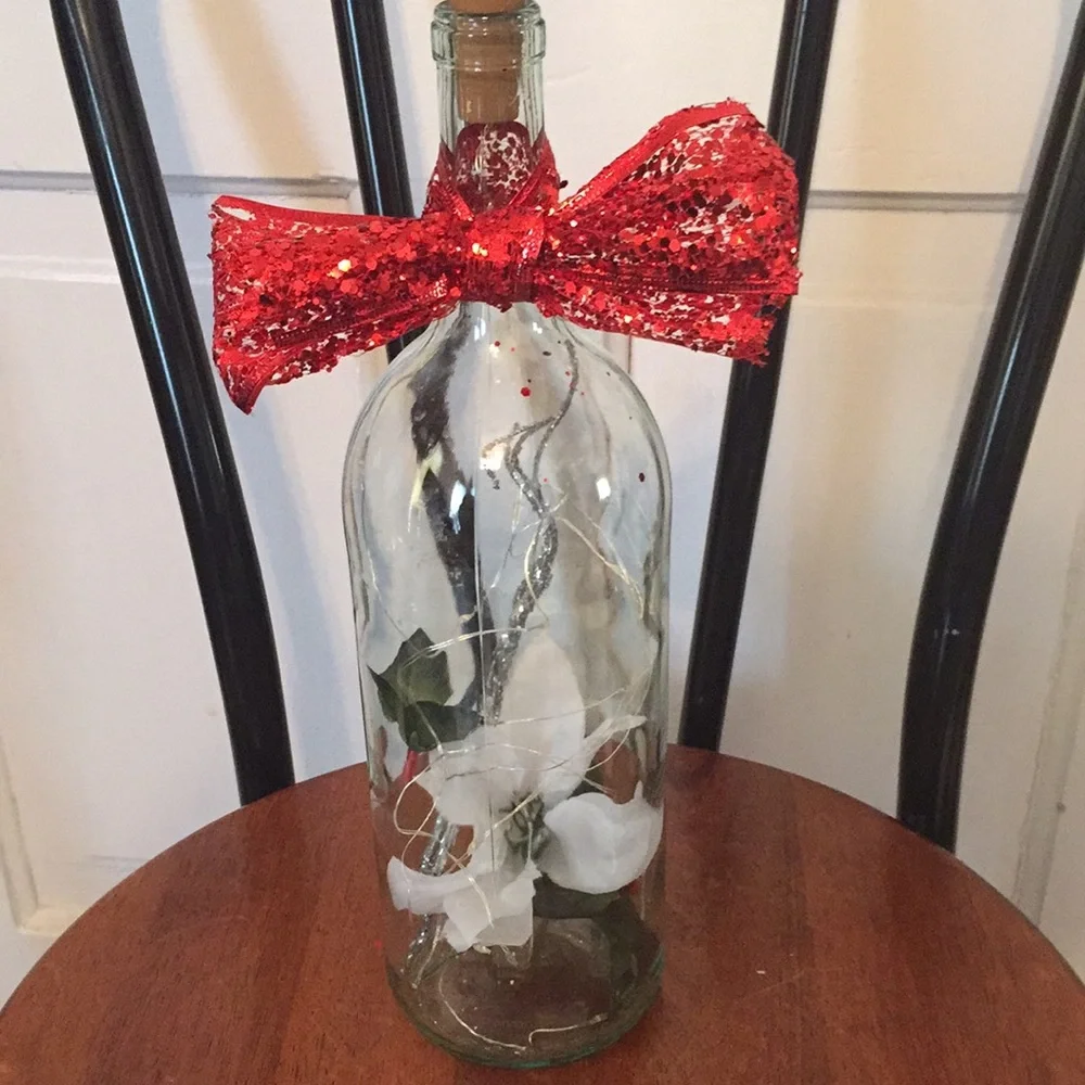 White poinsettia wine bottle lantern